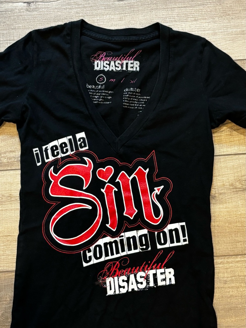 Beautiful Disaster Women’s Black V-Neck Tee with Red Graphic